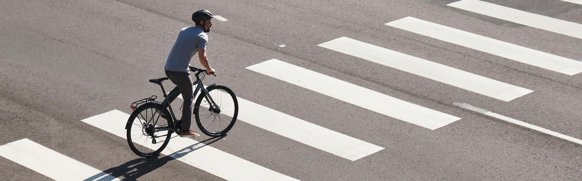Biker crossing a road in the city