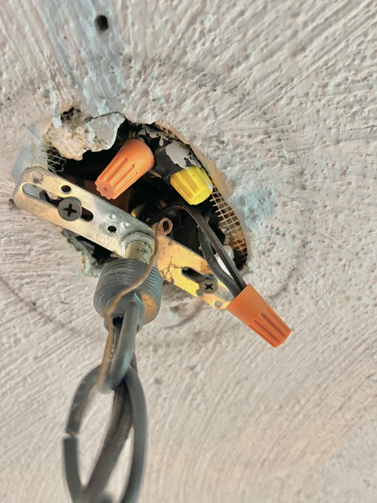 The ugly mess in the ceiling where I needed to wire the new light