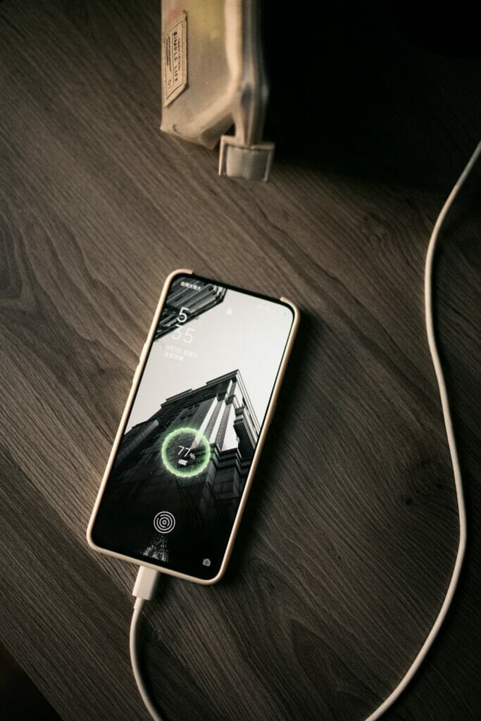 A phone charging on a surface